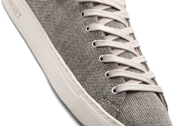This low-top sneaker comes with a natural rubber outsole. The upper is made of 100% undyed and unbleached black and white wool. The pure hemp lining, together with wool-covered cork insoles, ensures a fresh and healthy environment for your feet all day long. 
